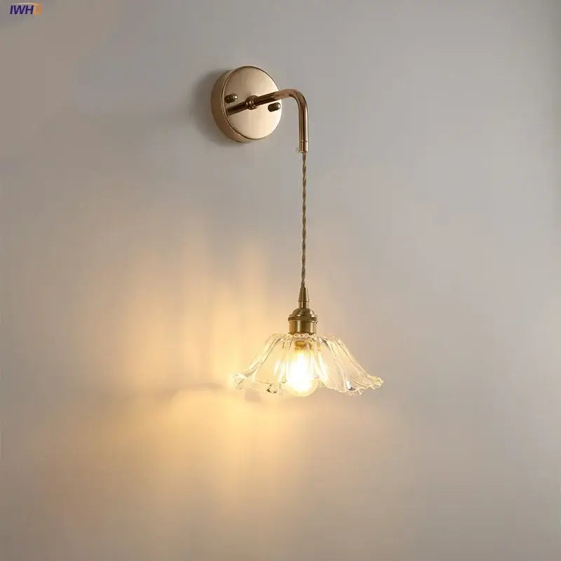 Modern petal clear glass led wall light with brass finish and delicate petal-shaped decorbites clear glass shade