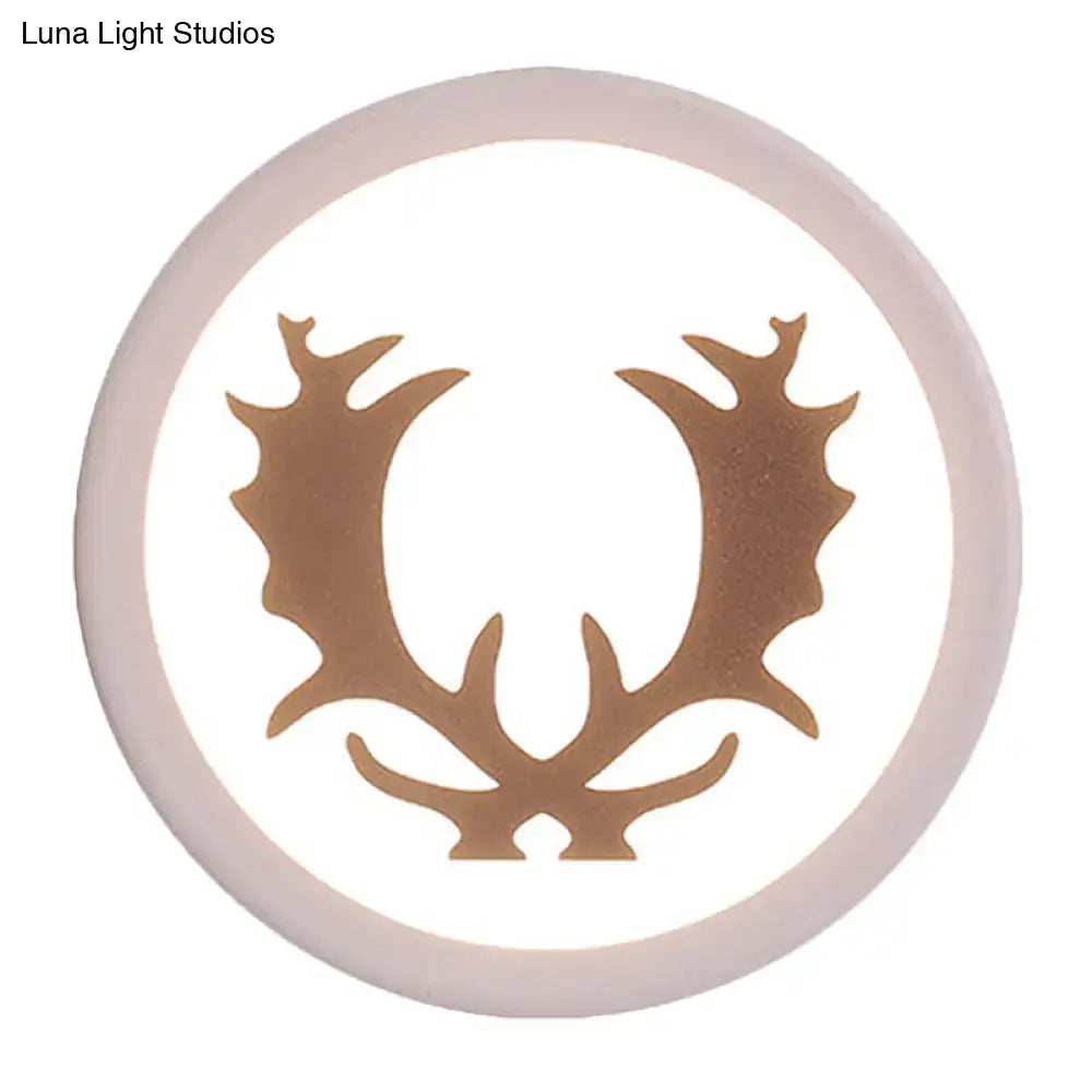 Modern pink and white deer horn bedside light with a circular white led inch fixture and bronze antler design center
