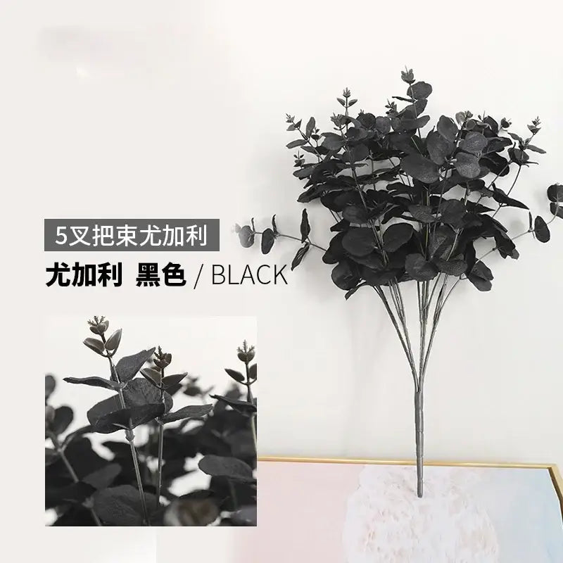 Black artificial eucalyptus flower arrangement with glossy round leaves in modern pink eucalyptus flower living room vase