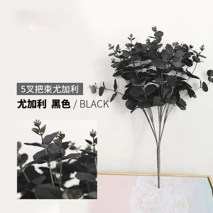 Black artificial eucalyptus flower arrangement with glossy round leaves in modern pink eucalyptus flower living room vase