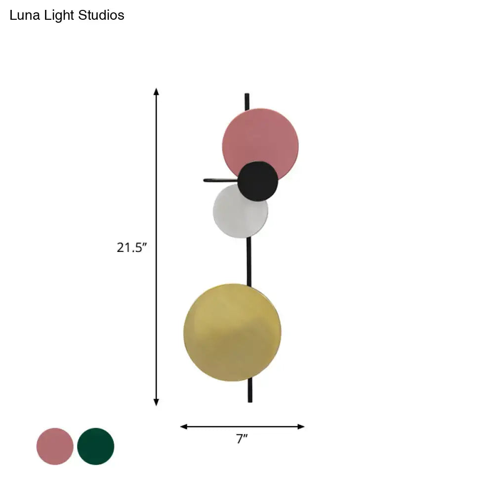 Modern pink and gold circular wall light with stacked matte shades in white yellow led for bedroom lighting