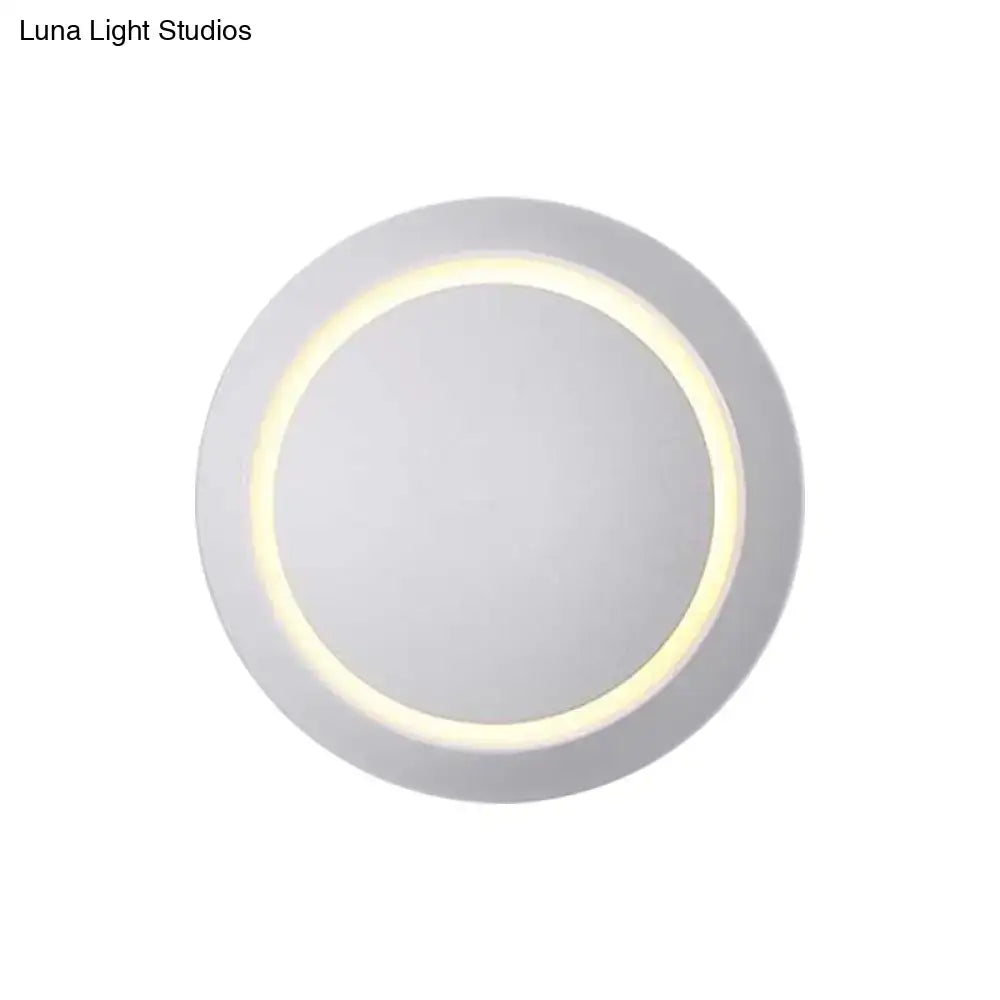 Modern pink and gold circular wall light with a sleek white finish and warm white yellow LED ring for bedroom use