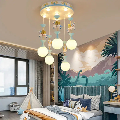 Modern pink and gold unicorn led chandelier with blue and white top and soft yellow bulbs for girls bedroom decorbites kids led