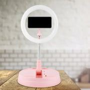 Modern pink metallic led flash light ring with smartphone stand ideal for bedroom use and makeup lighting