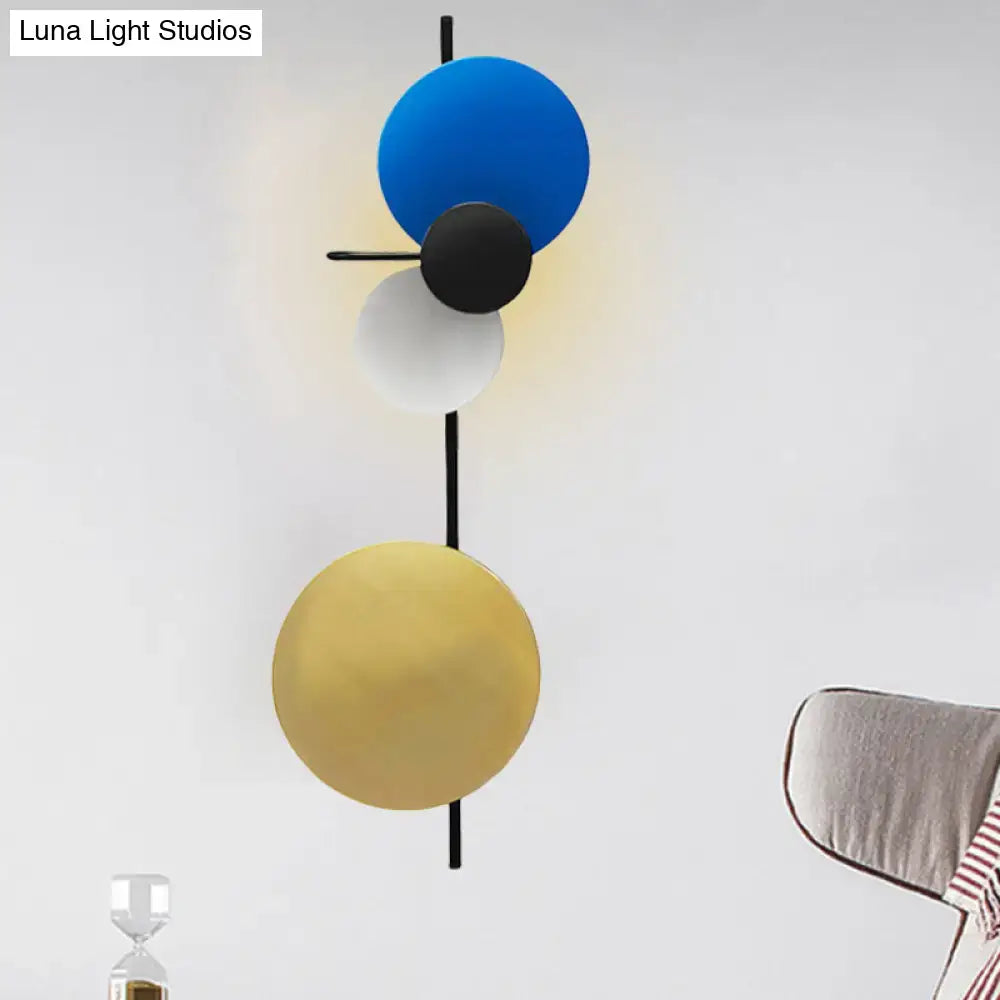 Modern wall mount light with three stacked blue black and gold matte spherical shades for living room circular wall mount