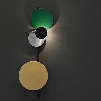 Modern pink silver and gold led wall lamp with green black and gold geometric discs for bedroom decor