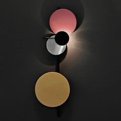 Modern pink silver and gold led wall lamp with geometric circular shades in pink black and gold for bedroom decor
