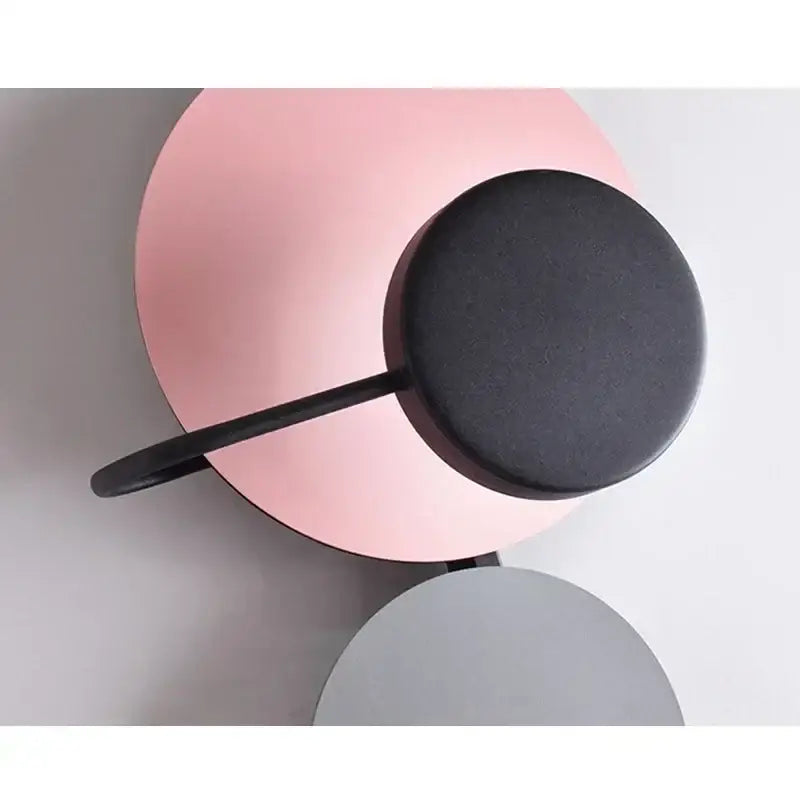 Modern pink silver and gold led wall lamp with matte black circular head and curved arm for bedroom decor wall lamp