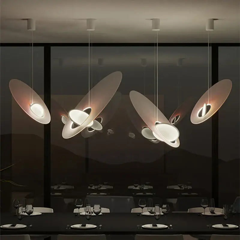 Modern pink and white oval glass pendant light with sleek disc-shaped design ideal for dining room decorbites colorful pendant
