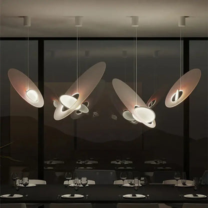 Modern pink and white oval glass pendant light with sleek disc-shaped design ideal for dining room decorbites colorful pendant