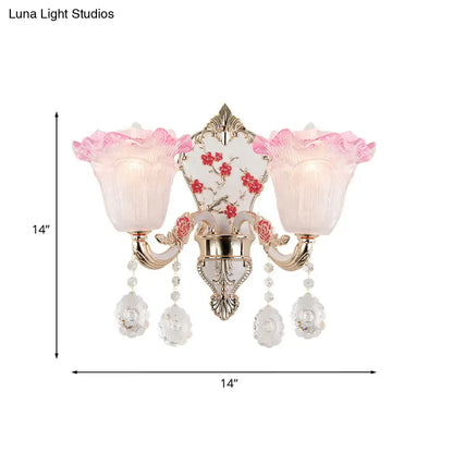 Elegant pink and white ruffle glass sconce lamp with gold metal accents and crystal pendants for modern wall lighting