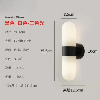 Modern black-and-white iron wall sconce with frosted glass and sleek vertical design for vanity mirror light use