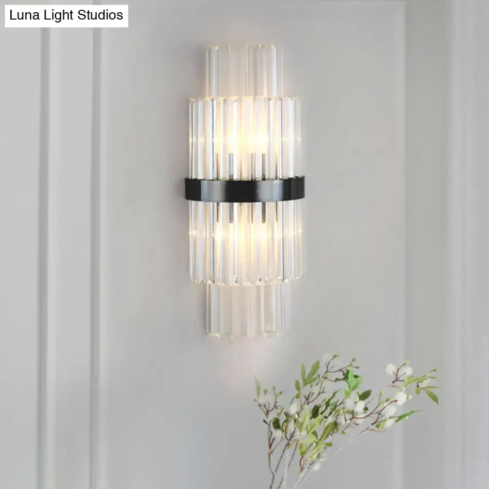 Modern prism black wall mount lamp with clear glass tubes and sleek black color suitable as a living room wall lamp