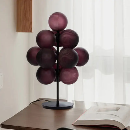 Modern purple decorbites glass bubble floor lamp with deep purple ribbed glass spheres on black metal stand for living room