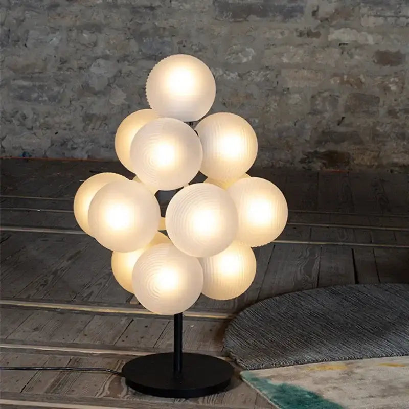 Modern purple decorbites glass bubble floor lamp with frosted glass spheres on black metal base for living room use