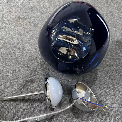 Modern purple lava pendant light featuring deep blue glossy ceramic and polished chrome finish with frosted glass bulb