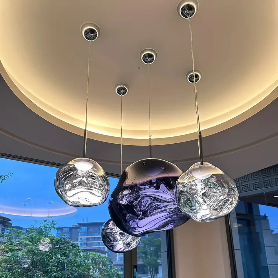 Modern purple lava pendant light with swirling metallic hues and polished chrome finish for kitchen decor