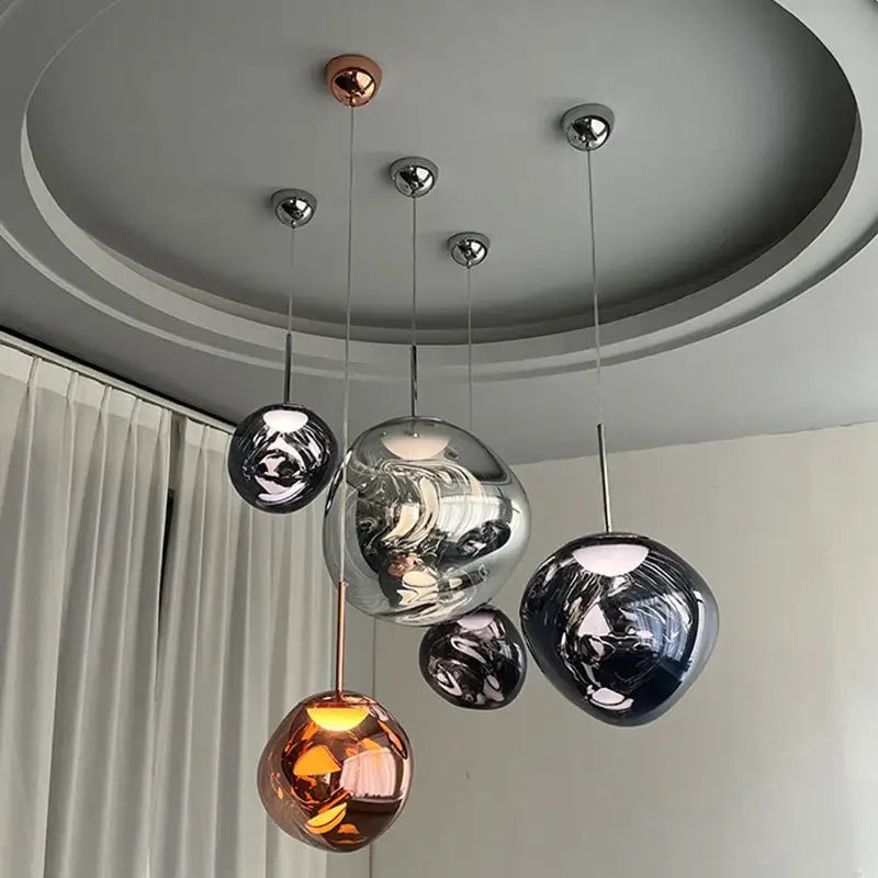 Modern purple lava pendant light with polished chrome finish featuring spherical glass pendant lights in copper silver and dark gray