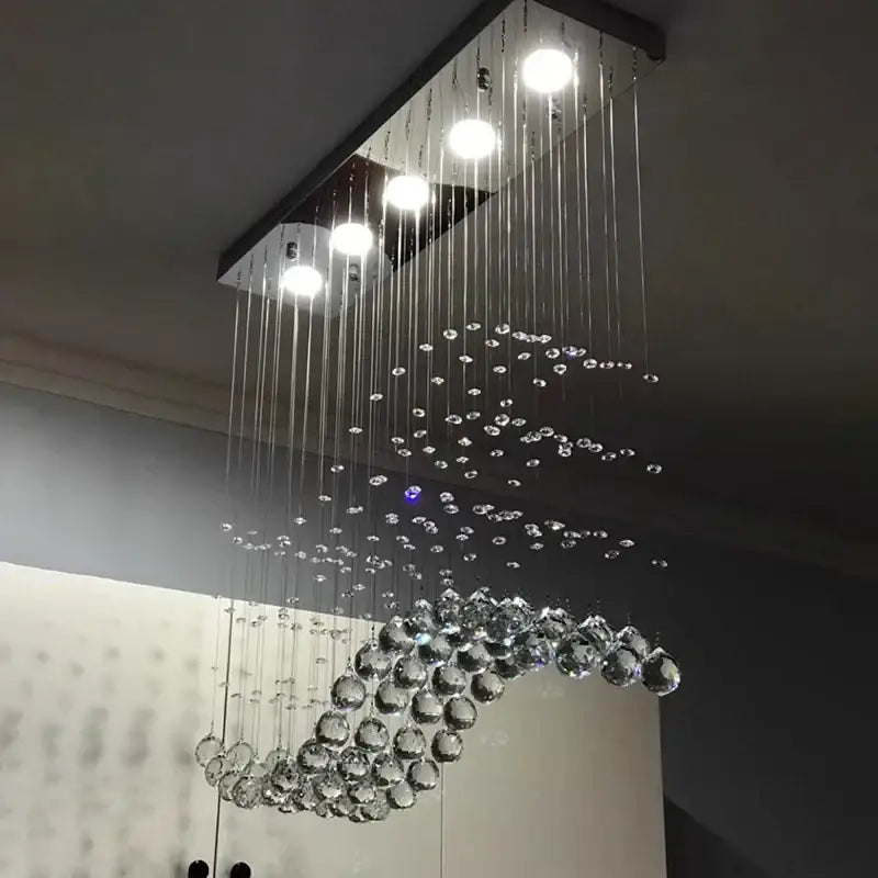Modern rectangle crystal led chandelier with sleek black frame and cascading clear crystals for dining room decorbites crystal led