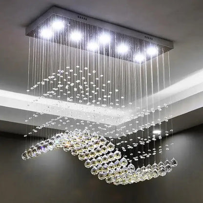 Modern rectangle crystal led chandelier dining room pendant light with sleek metallic frame and cascading clear crystal droplets by decorbites crystal led