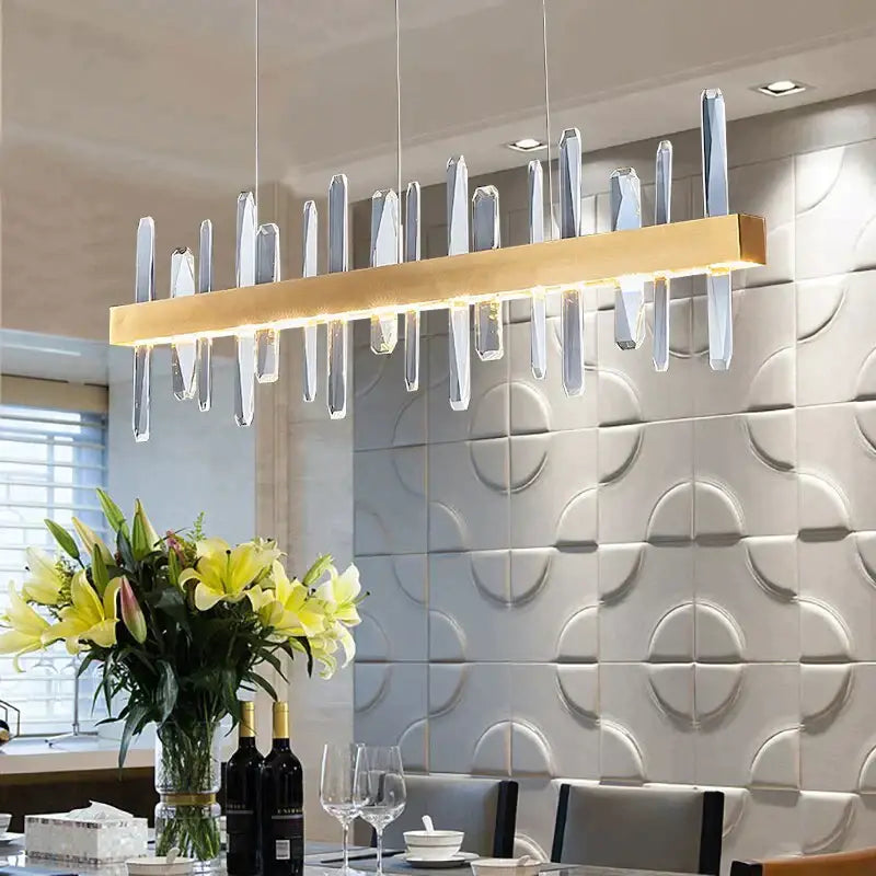 DecorBites™ Kyala modern rectangle gold crystal chandelier with clear vertical rods on a sleek gold-accented bar
