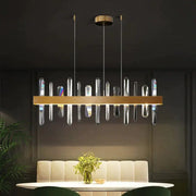 Modern rectangle gold crystal chandelier featuring clear prisms suspended from a sleek metallic frame by DecorBites™