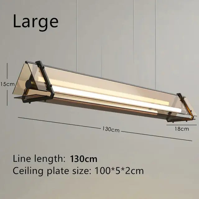 Modern rectangular amber led pendant lamp with sleek black metal frame and transparent panels for dining room decorbites amber led