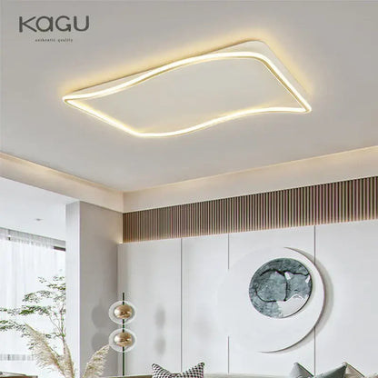 Modern rectangular golden led ceiling chandelier with sleek curved led edge emitting warm white illumination for living room decorbites golden led
