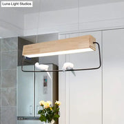 Decorbites modern rectangular pendant light with natural wood top black metal frame and white ceramic birds for dining room