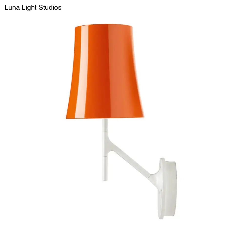 Modern red and white barrel wall mount sconce featuring a vibrant orange conical lampshade on a sleek metallic fixture