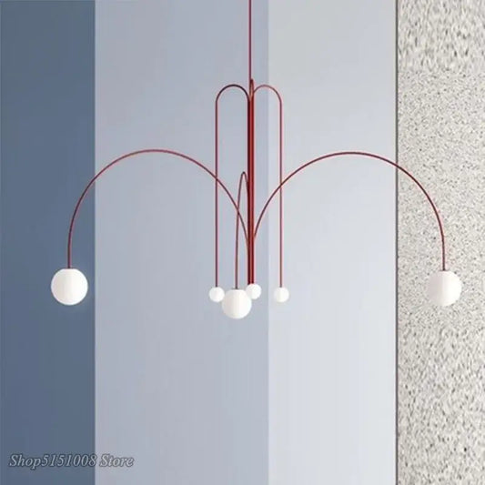 Modern red and white branch glass pendant lights featuring curved arms and spherical glass globes for living room decor