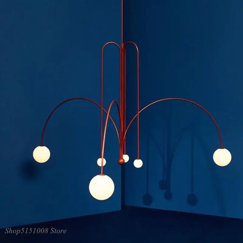 Modern copper-toned branch glass pendant lights with curved metal arms and frosted globe lights for living room decorbites branch glass