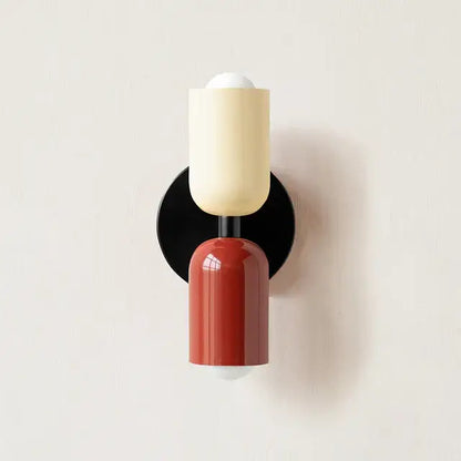 Modern red and black glossy led wall lamp with circular base and cream upper bulb housing for bedroom decor