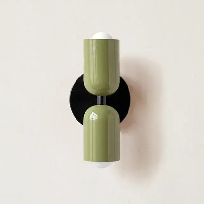 Modern olive green led wall lamp with cylindrical design, black base, and two frosted bulb holders for living room decor