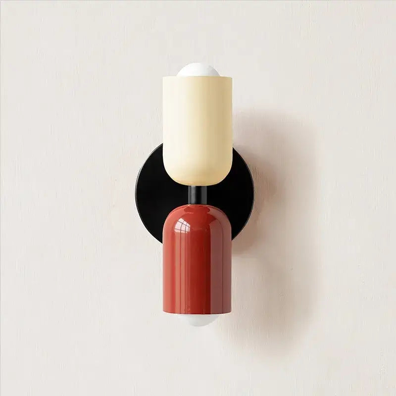A modern red and black glossy led wall lamp with stacked cream and red shades for bedroom and living room decor
