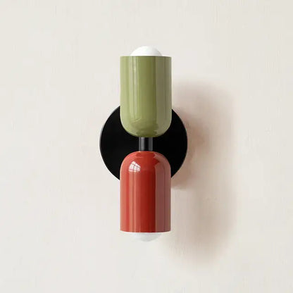 Modern two-tone led wall lamp with olive green and terracotta cylindrical shades on black circular base for decor