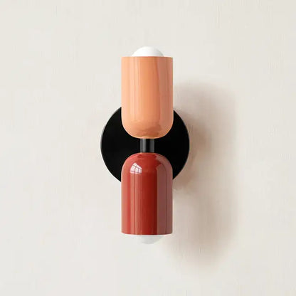 Modern red and black glossy led wall lamp with matte peach and terracotta two-toned design for bedroom decor
