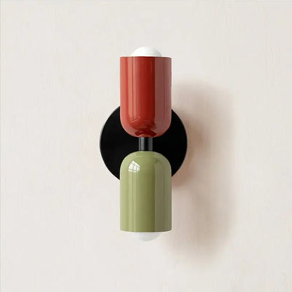 Modern led wall lamp with glossy red and matte olive green two-toned design on black circular base for bedroom decor