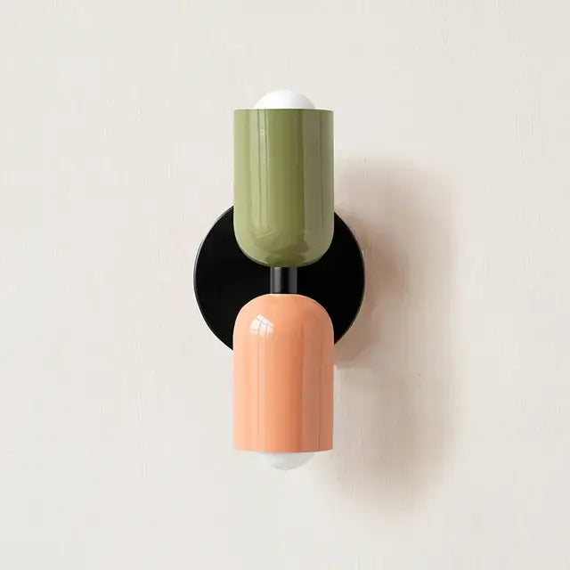 Modern red and black glossy led wall lamp with olive and peach cylindrical sconce and black base for living room decor