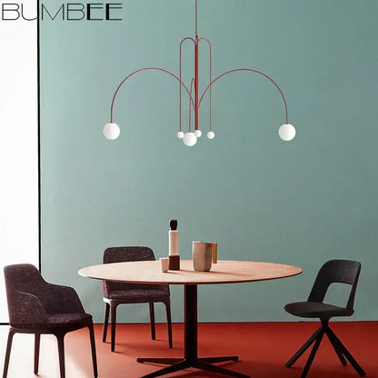 Bumbee modern red decorbites designer line chandelier with curved metal arms and white glass globe bulbs for living room