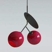 Modern red glass cherry led pendant light with glossy spheres and matte black metal stem for dining room decorbites cherry led