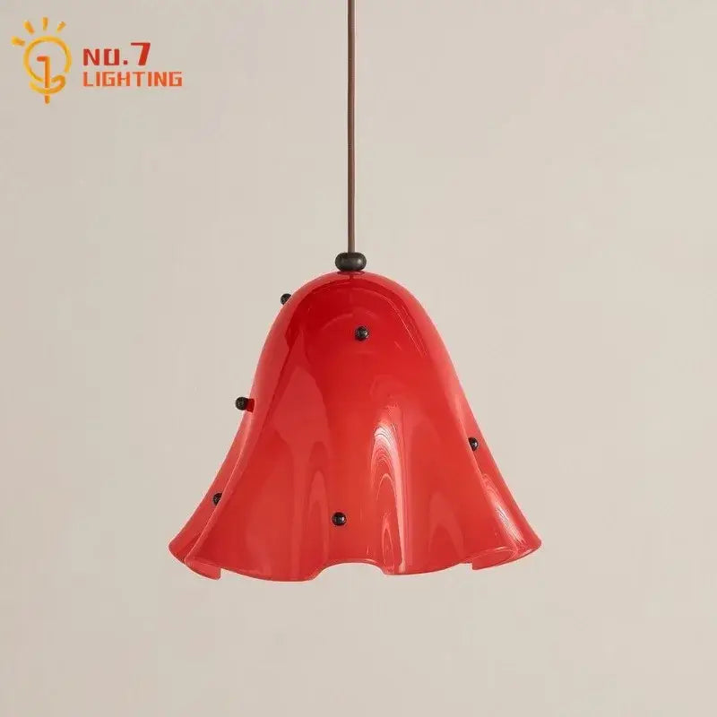 Modern red glass pendant light with black dots featuring a vibrant bell-shaped design and glossy finish for dining room