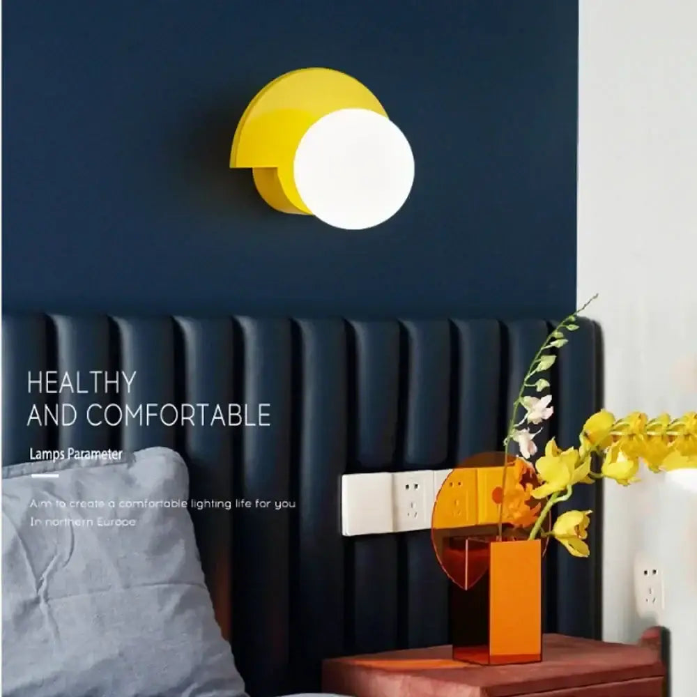 Modern yellow and white circular wall lamp with sleek minimalist decorbites glass ball led design for ambient bedroom light