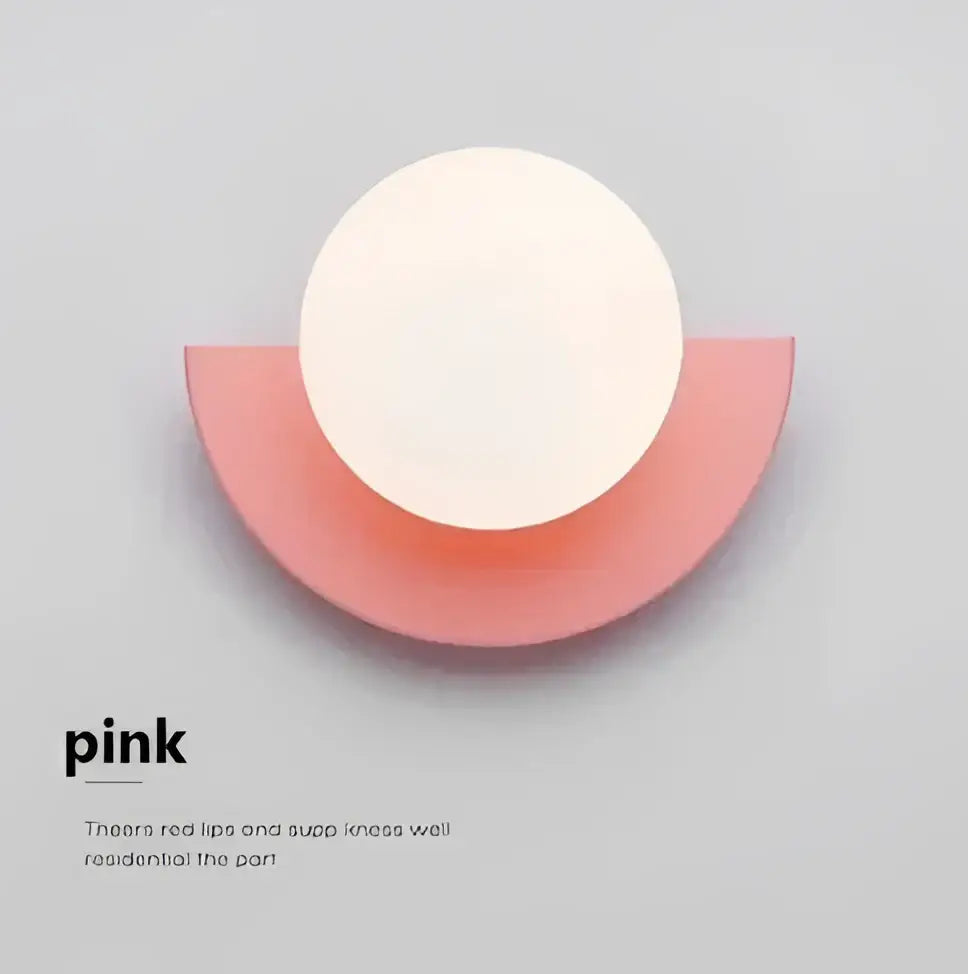 Modern red and orange decorbites glass ball led wall lamp with a minimalist pink and white circular wall-mounted shelf