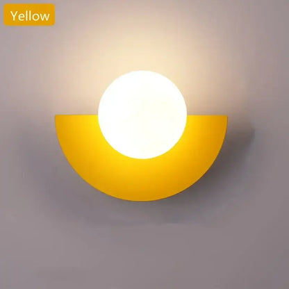 Yellow semi-circular wall lamp with a glowing white glass ball led bulb for modern bedroom decorbites ambient light