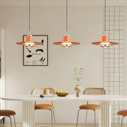 Modern red colorful umbrella pendant lamp with warm orange circular shades and metallic fixtures for dining room decorbites decor