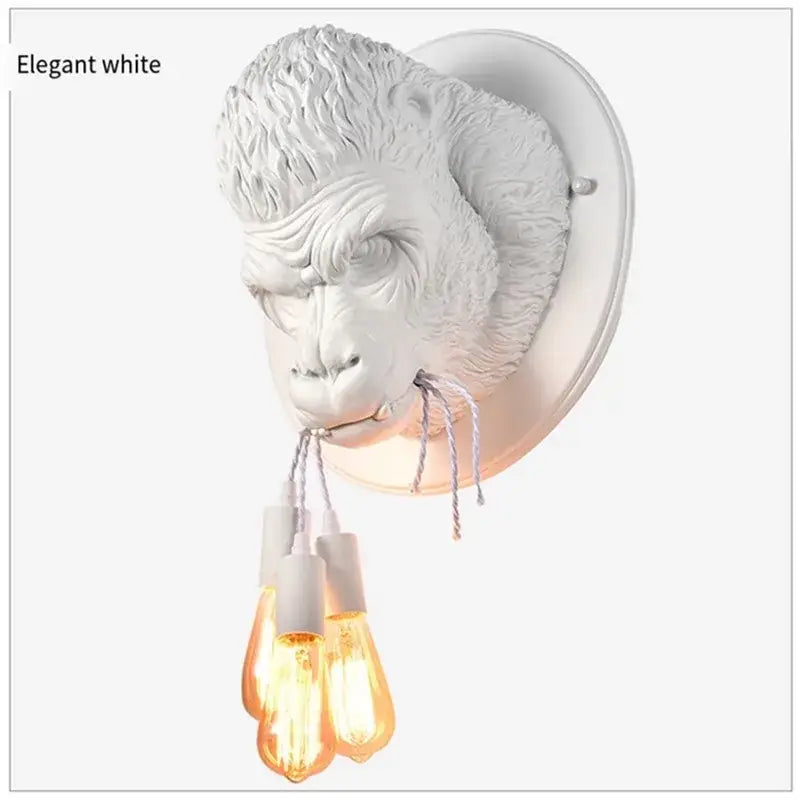 Elegant white wall lamp shaped like gorilla head with three filament bulbs decorbites gorilla resin bedroom sconce