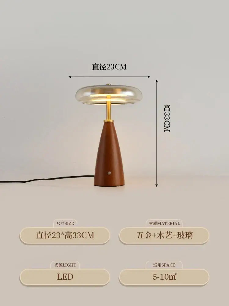 A sleek modern table lamp with decorbites gold lustre brass base and clear glass dome shade for bedroom decor