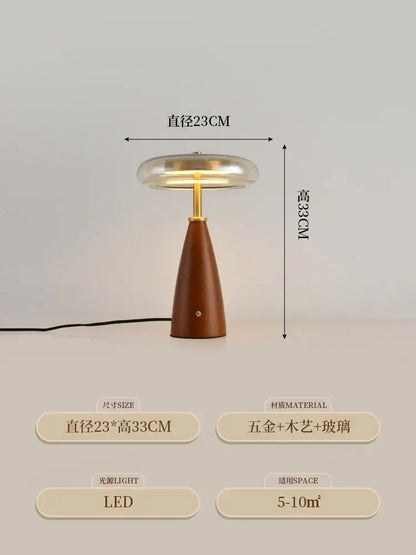 A sleek modern table lamp with decorbites gold lustre brass base and clear glass dome shade for bedroom decor