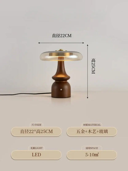 A sleek modern table lamp with a warm brown gold lustre wood base and translucent glass top by decorbites gold lustre